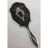 A HM silver tortoiseshell hand mirror with ornate silver inlay (London 1919)