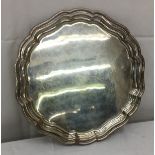 A HM silver tray on three ball feet, Birmingham, 1929, by Joseph Gloster Ltd: W 24.