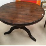 An early 20th century mahogany breakfast table