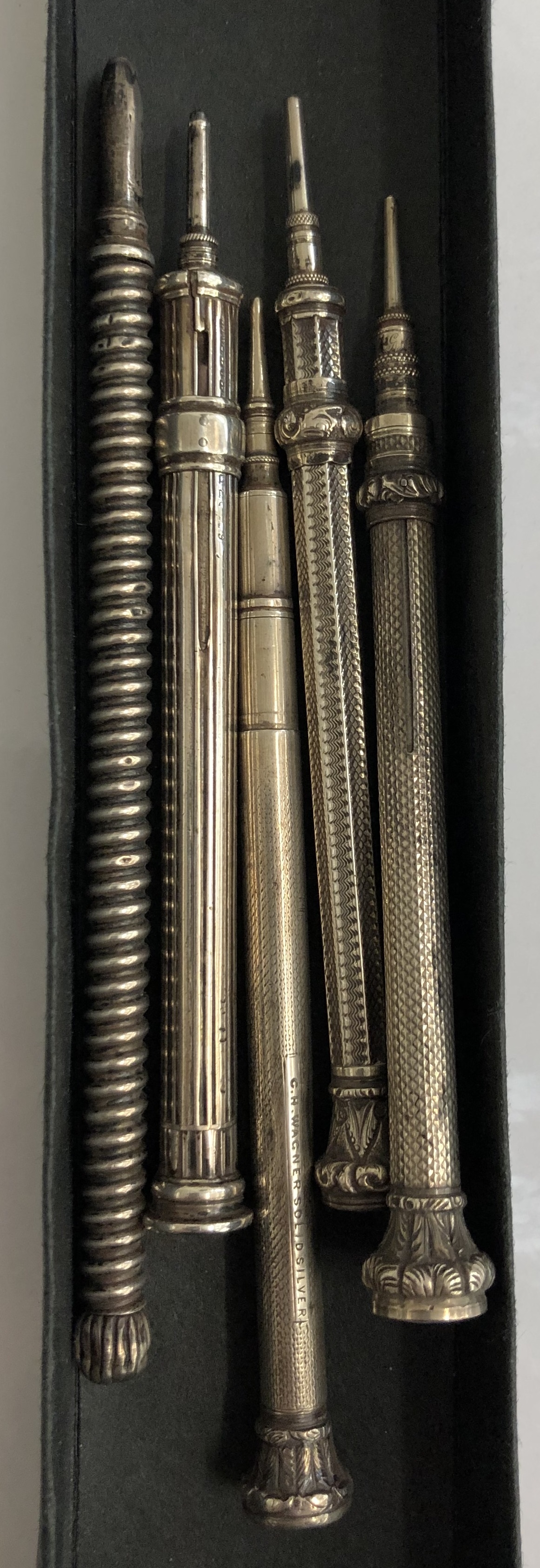 Five large HM silver propelling pencils