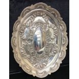 A Victorian HM Silver oval embossed bowl with card cut edges,