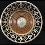 A 1973 Bristol 600 commemorative wine coaster with bright cut fretwork and silver medallion to