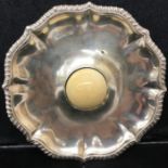 A Victorian HM silver legged salver with removeable central semi-sphere of ivory,