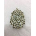 A silver opal pendant: abstract design