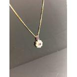 An 18ct amethyst and diamond set pendant on chain