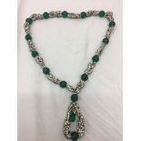 A 1950s paste diamond and emerald necklace