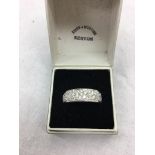 An 18ct diamond set half eternity ring