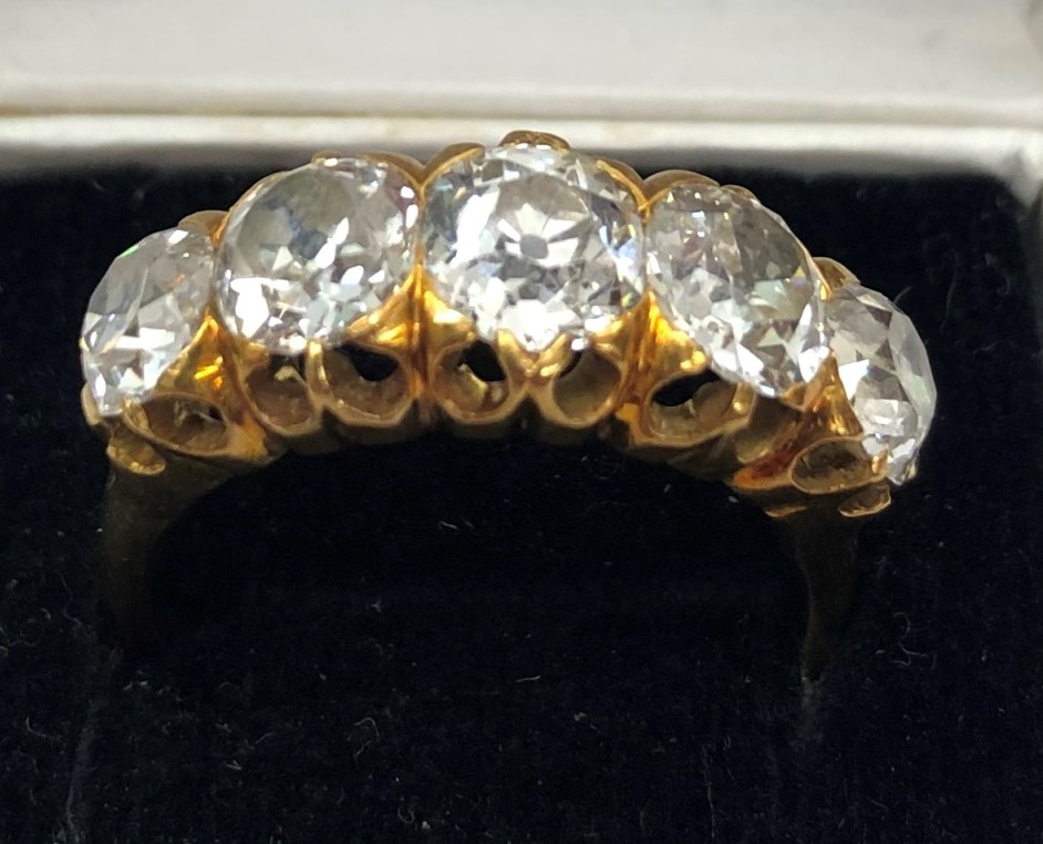 A large five-stone diamond ring