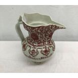 A red and white Tibetan teapot