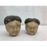 A pair of earthenware Chinese heads