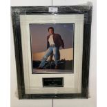 A framed & glazed signed photograph of Tom Jones with COA