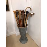 A zinc walking stick stands and sticks: hockey etc