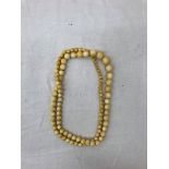 A 19th century ivory bead necklace