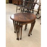 A nest of three walnut tables