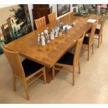 A modern extending dining table and six chairs