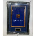 A framed & glazed multi signed 2006 Barcelona shirt with letter from Barcelonas head of relations &