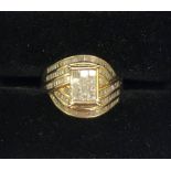 A 9ct gold diamond dress ring with raised diamond set baguettes