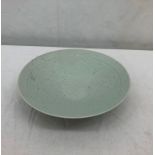 A Celadon-style Chinese plate with floral decoration