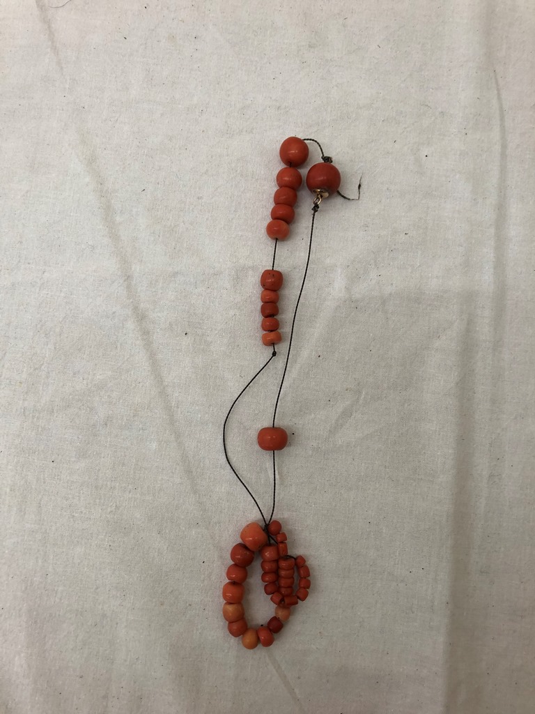A red coral necklace with large beads