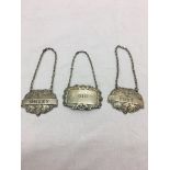 Three HM silver decanter labels