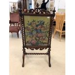 A 19th century mahogany fire screen