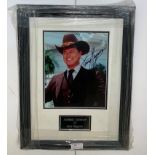 A framed & glazed signed photograph of Larry Hagman with COA