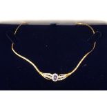 A 14ct gold diamond and tanzanite necklace