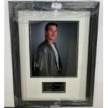 A framed & glazed signed photograph of Patrick Swayze with COA
