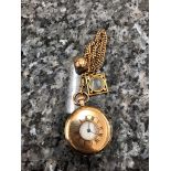 A 9ct half-hunter pocket wach on a 9ct Albert chain with gold compass and gold ball