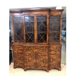 An Edwardian mahogany breakfront secretaire bookcase