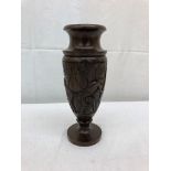 A carved hardwood ebonised tribal vase;