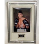 A framed & glazed signed photograph of Muhammad Ali with COA