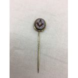 A hardstone carved Masonic pin