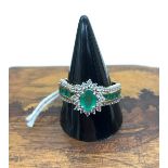 A 9ct gold diamond and emerald dress ring