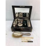 A 19th century silver-plated coromandel dressing set;