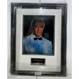 A framed & glazed signed photograph of Robert Redford with COA