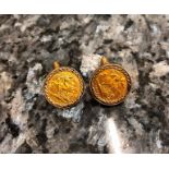 A pair of sovereign cufflinks (1903 and 1909) in a 9ct mount