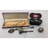 A quantity of odds to inc mother-of-pearl opera glasses, pearls with silver clasp, whistle,