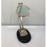 A large magnifying glass on stand