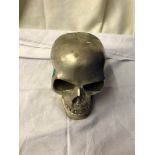 A silver metal skull