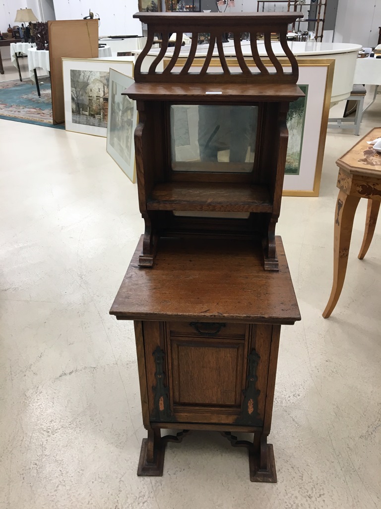 An Art Nouveau oak coal box with mirrored back