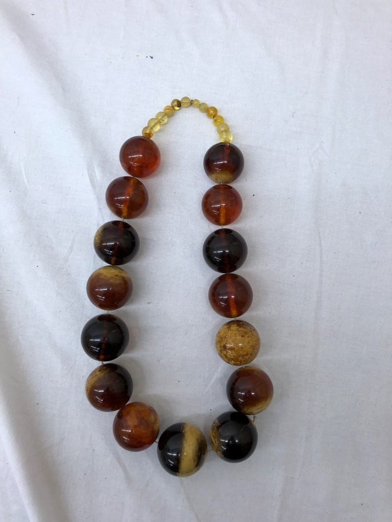 A large amber beaded necklace: half kilo