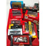 A box of boxed diecast motorbikes