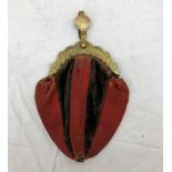 A cloth purse with brass clasp,