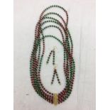 A ruby and emerald necklace and earrings
