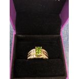 A 10ct gold green diamond dress ring