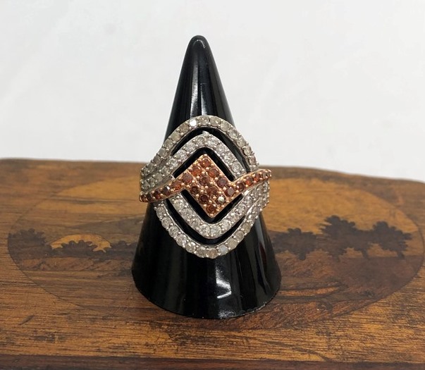 A 9ct diamond and red diamond dress ring