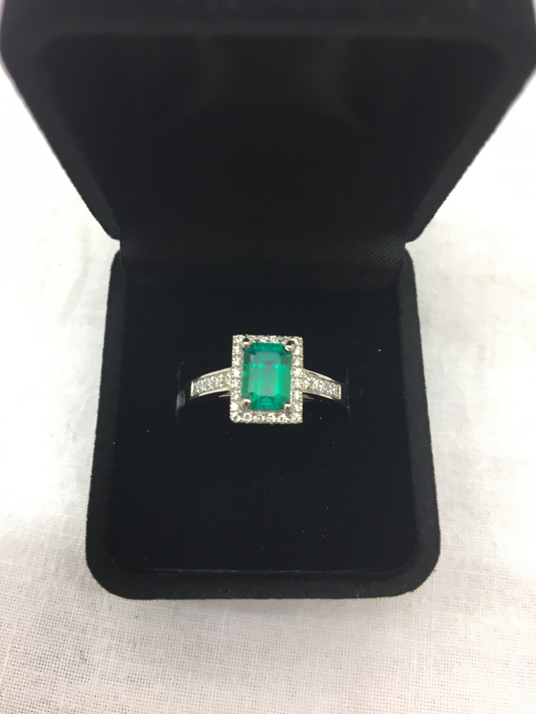 A 950 platinum and diamond emerald ring: high grade Columbian 0.