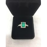 A 950 platinum and diamond emerald ring: high grade Columbian 0.