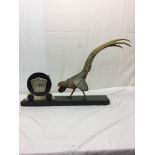 An Art Deco clock with metal pheasant figure on a marble base